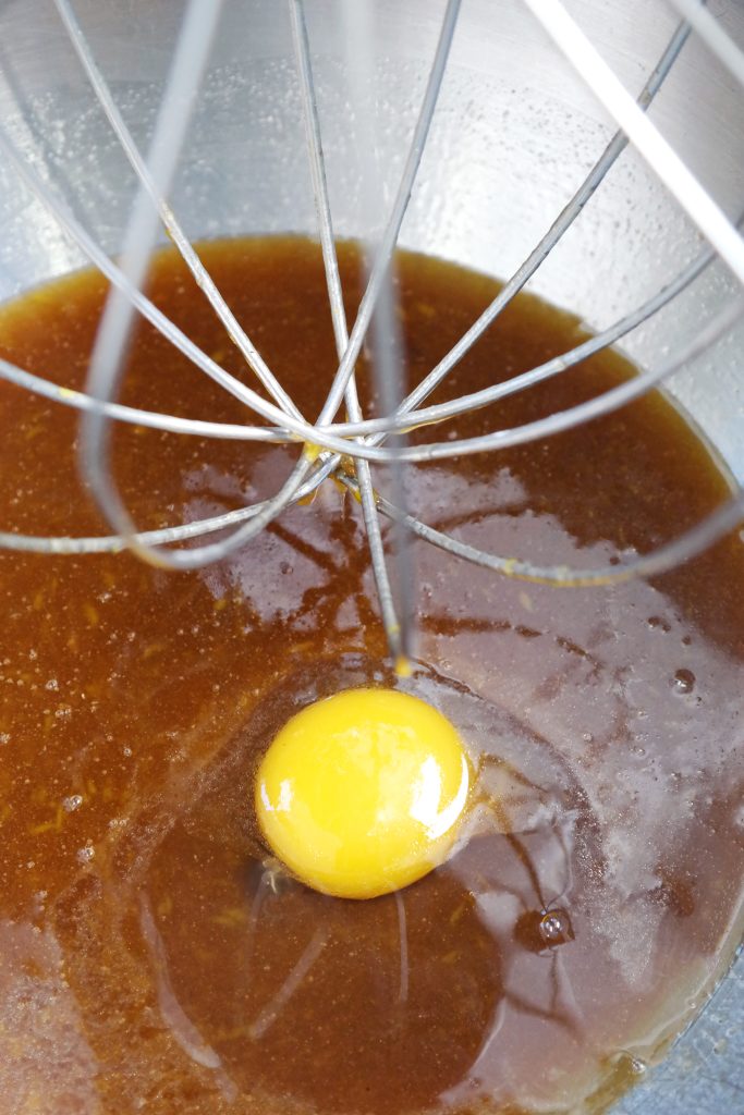 Adding the egg to the honey cake