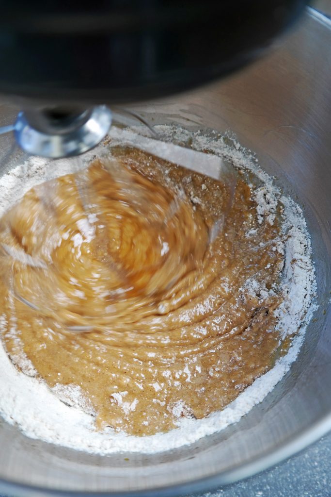 Mixing the honey cake batter with a whisk